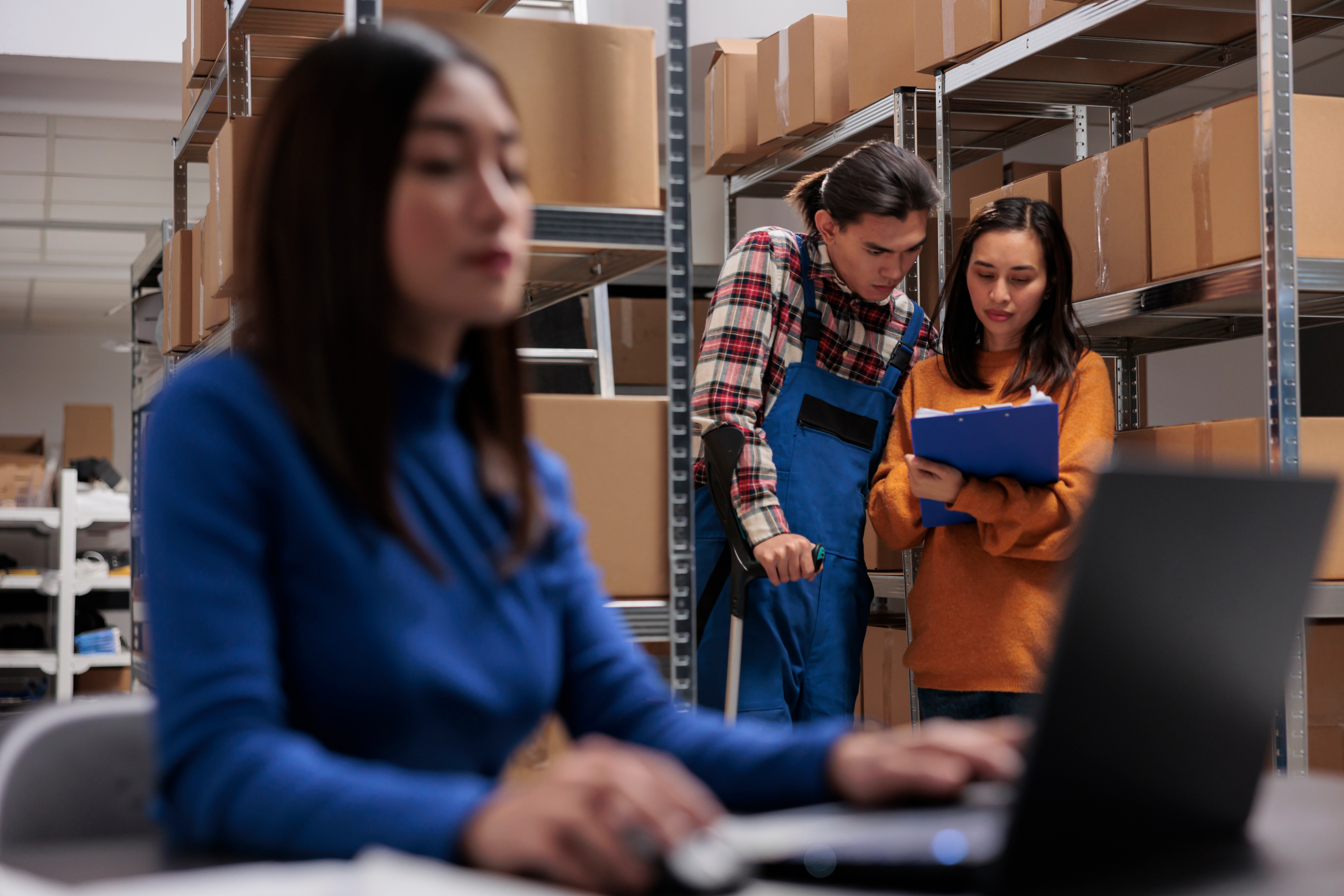 Warehouse workers collaborating